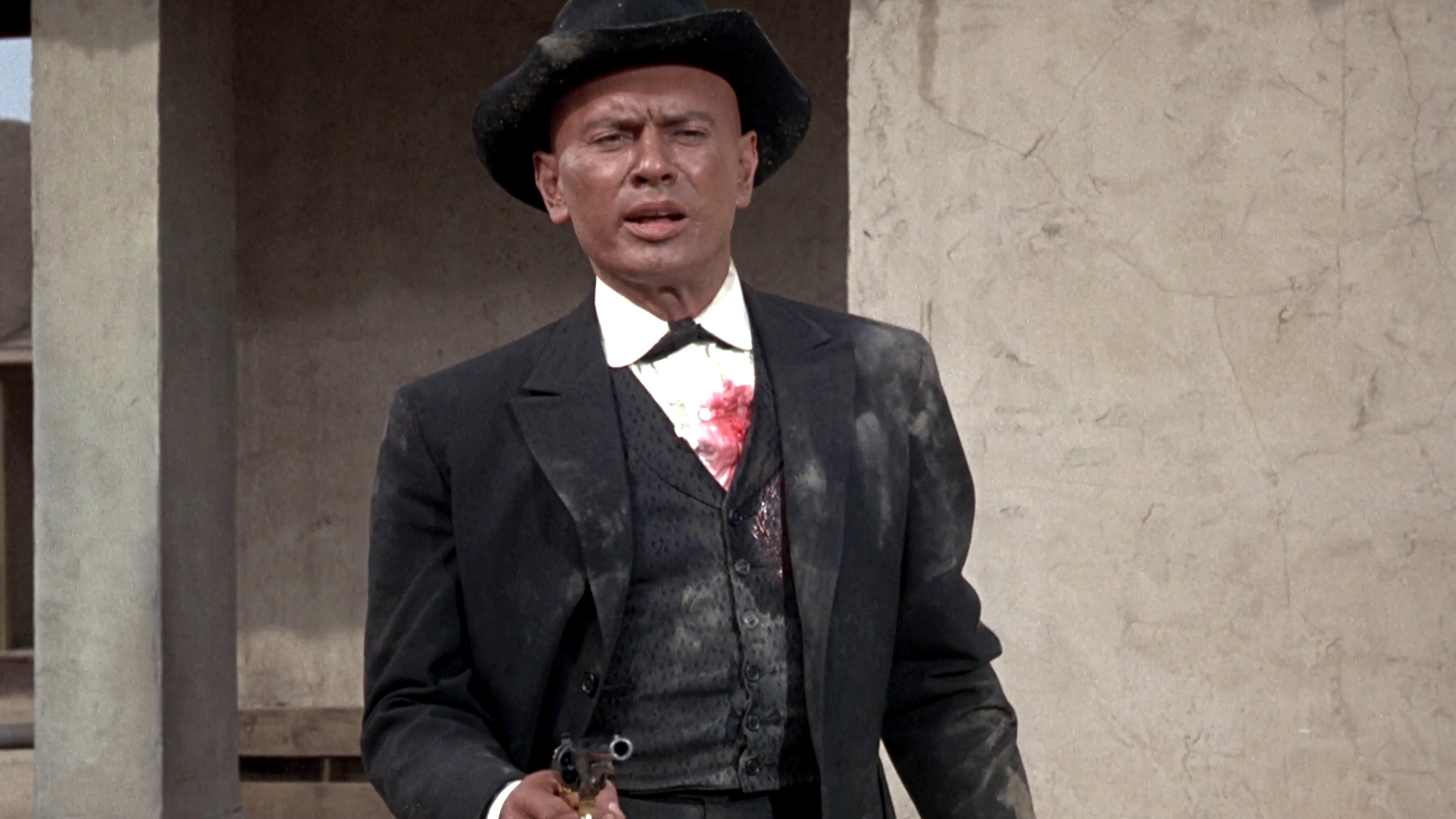 Invitation to a Gunfighter Background